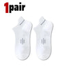 A pair of white premium breathable men's running socks shown flat.