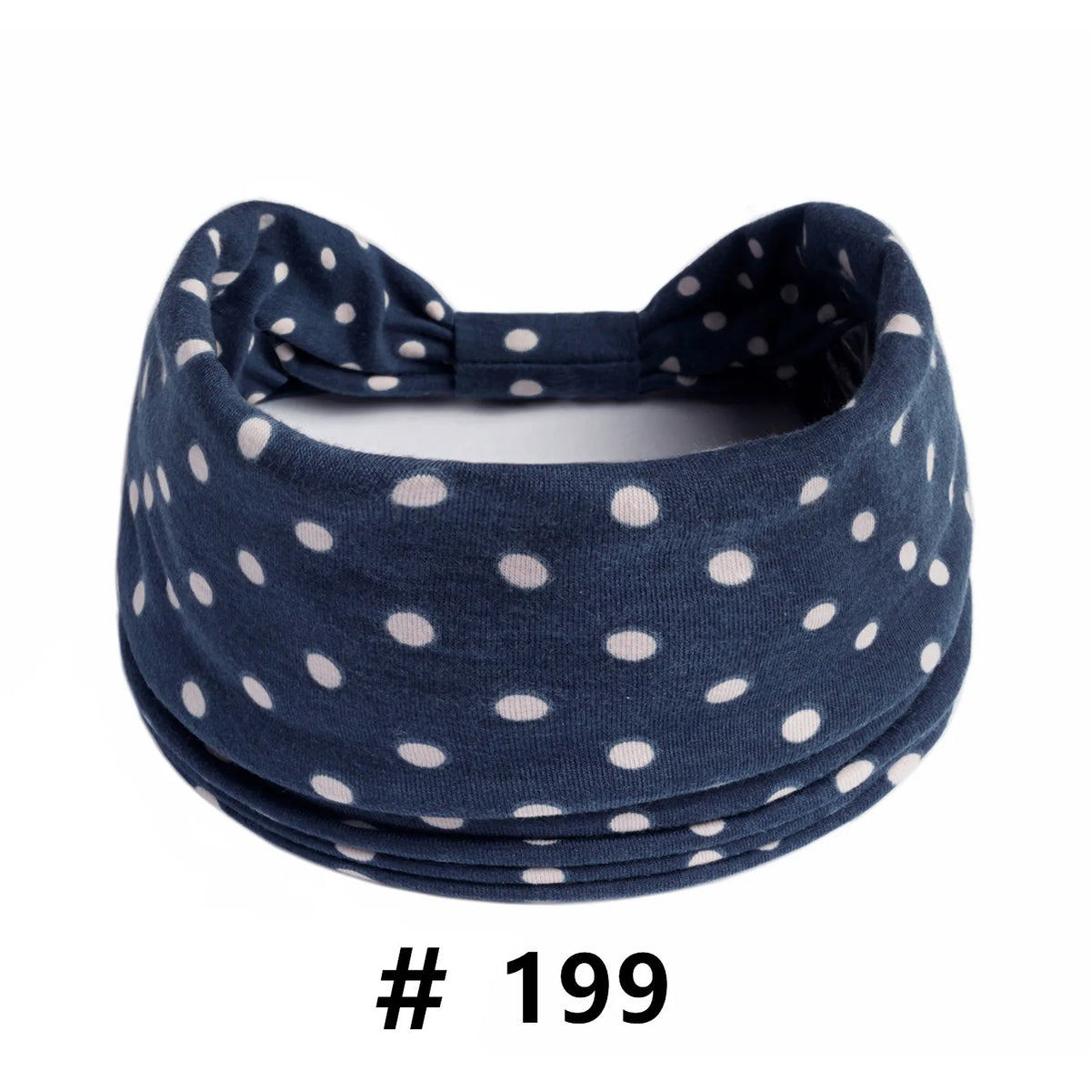 Navy blue polka dot knotted headband for yoga and workout
