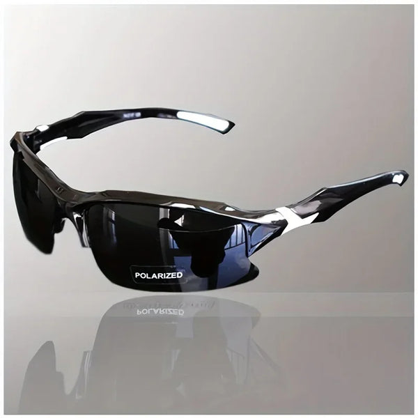 A pair of black polarized sport sunglasses resting on a reflective surface.
