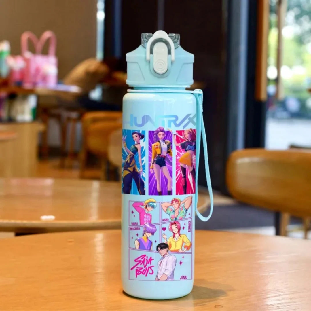 A light blue cartoon character water bottle with a carrying strap sitting on a wooden table.