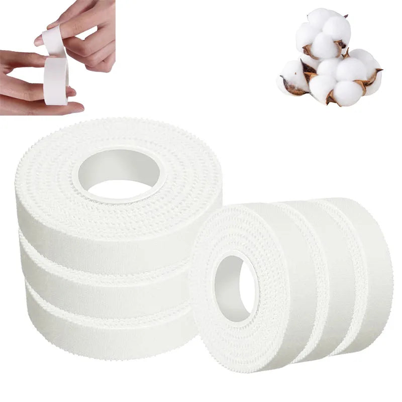 Rolls of white athletic finger tape and a hand applying the tape.
