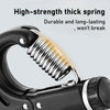 Close-up of a high-strength thick spring inside a black hand grip strengthener device.