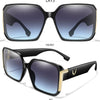 A pair of black square sunglasses shown from the front and a top-down view, with a 45 degree angle.