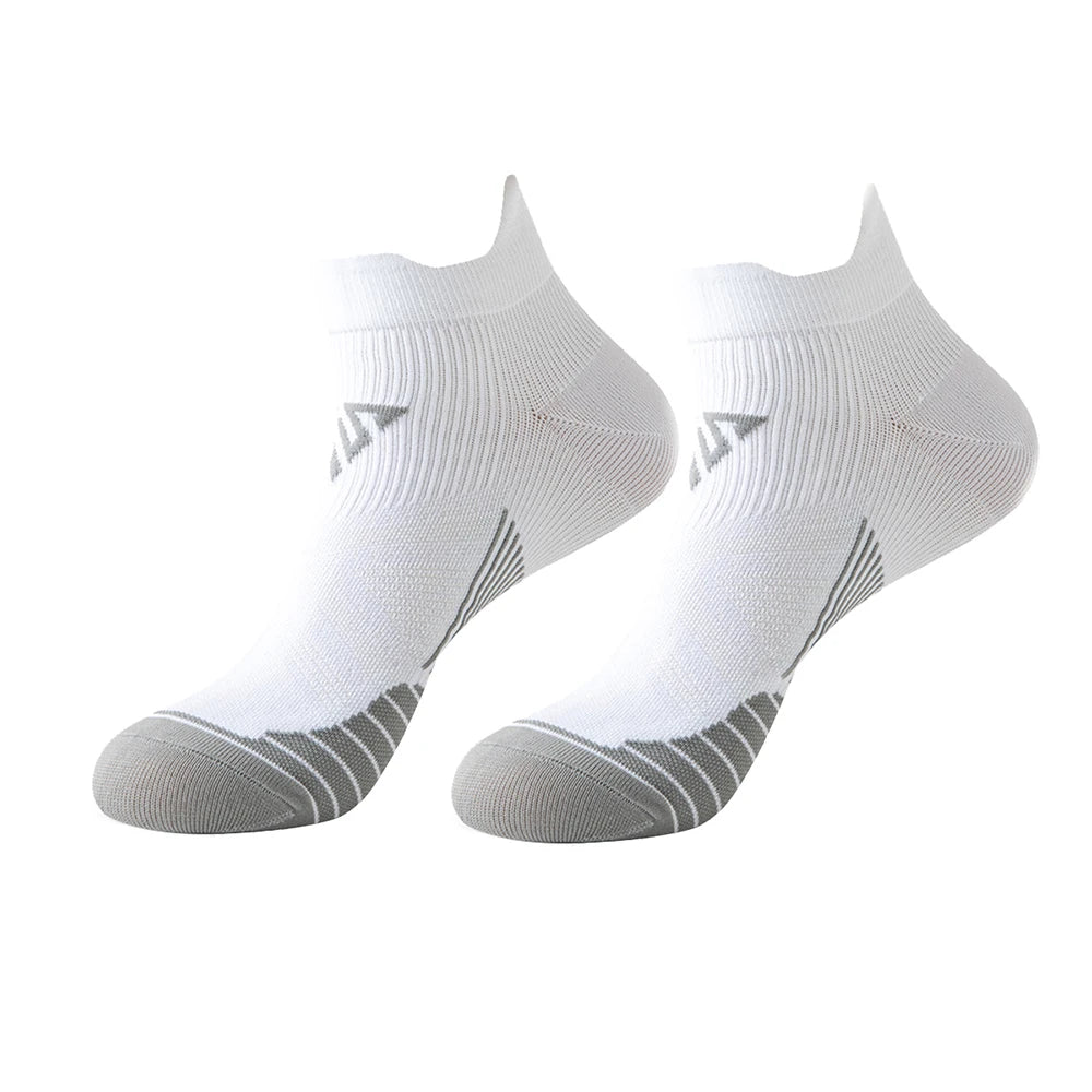 A pair of white breathable anti-blister running socks shown from the side.