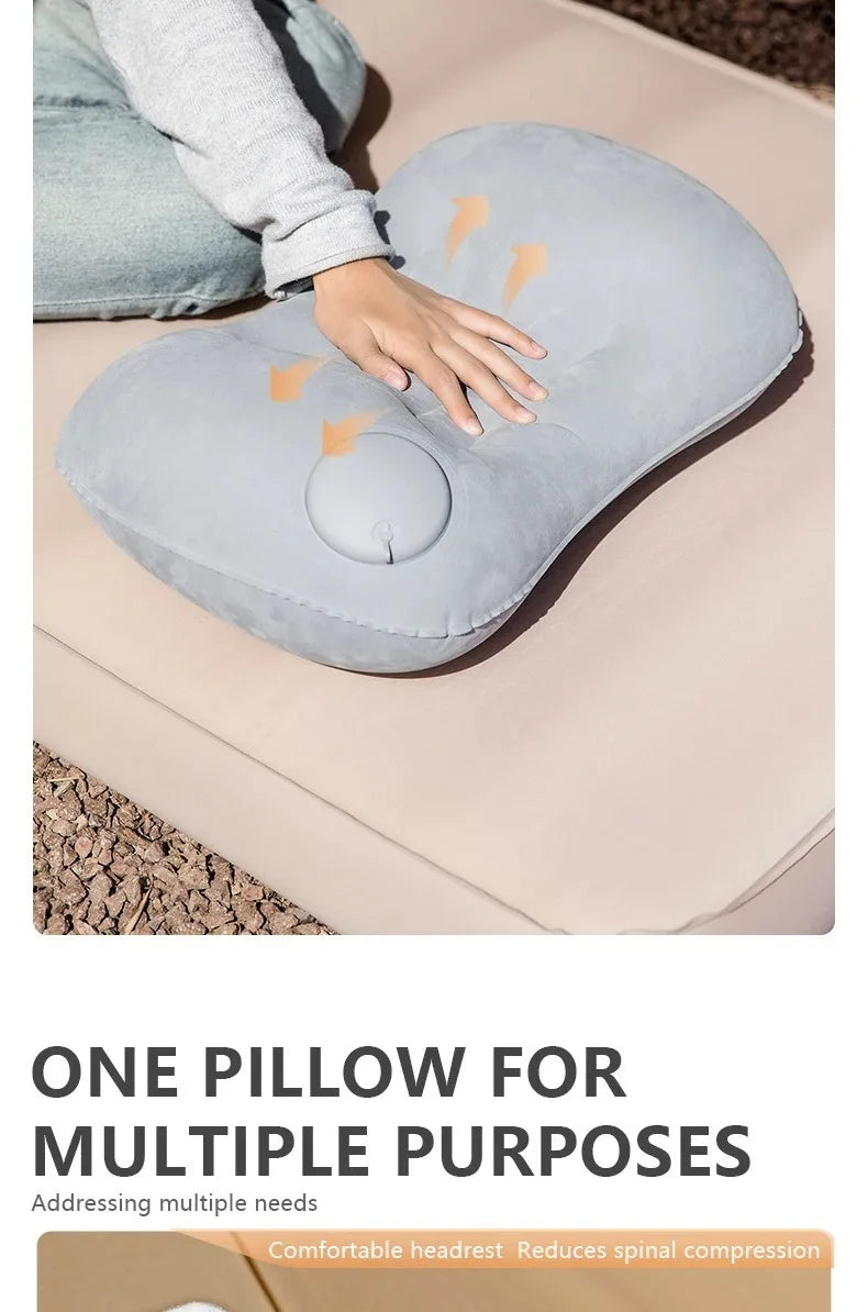 A gray inflatable pillow is shown being used for neck and lumbar support on a person's hand.