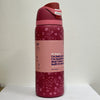 A pink vacuum insulated water bottle with a straw and a lid is shown standing upright against a white background.