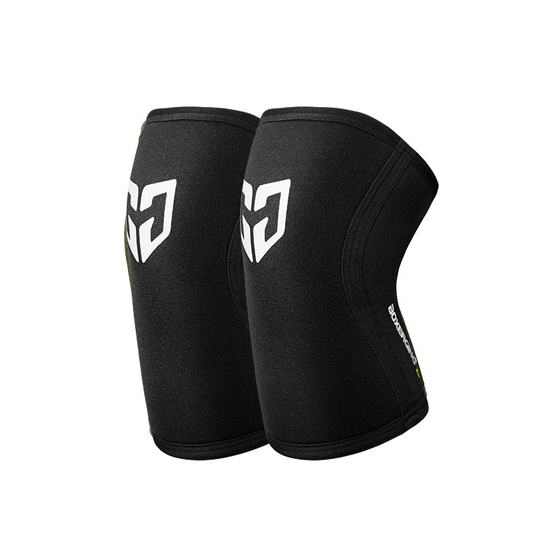 A pair of black compression knee sleeves for sports and gym.