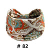 Boho print cotton headband featuring an orange, teal, and brown paisley pattern.