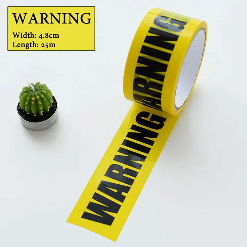 A roll of yellow and black industrial safety warning tape with dimensions listed.