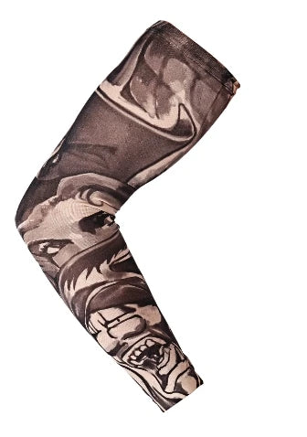 A dark gray seamless tattoo sleeve worn on an arm, featuring intricate black and white designs.