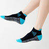 A close-up of a pair of black knit sports socks with bright blue accents and a textured gray pattern.