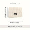 A beige knitted winter headwrap with the brand name GRANK visible on the front.