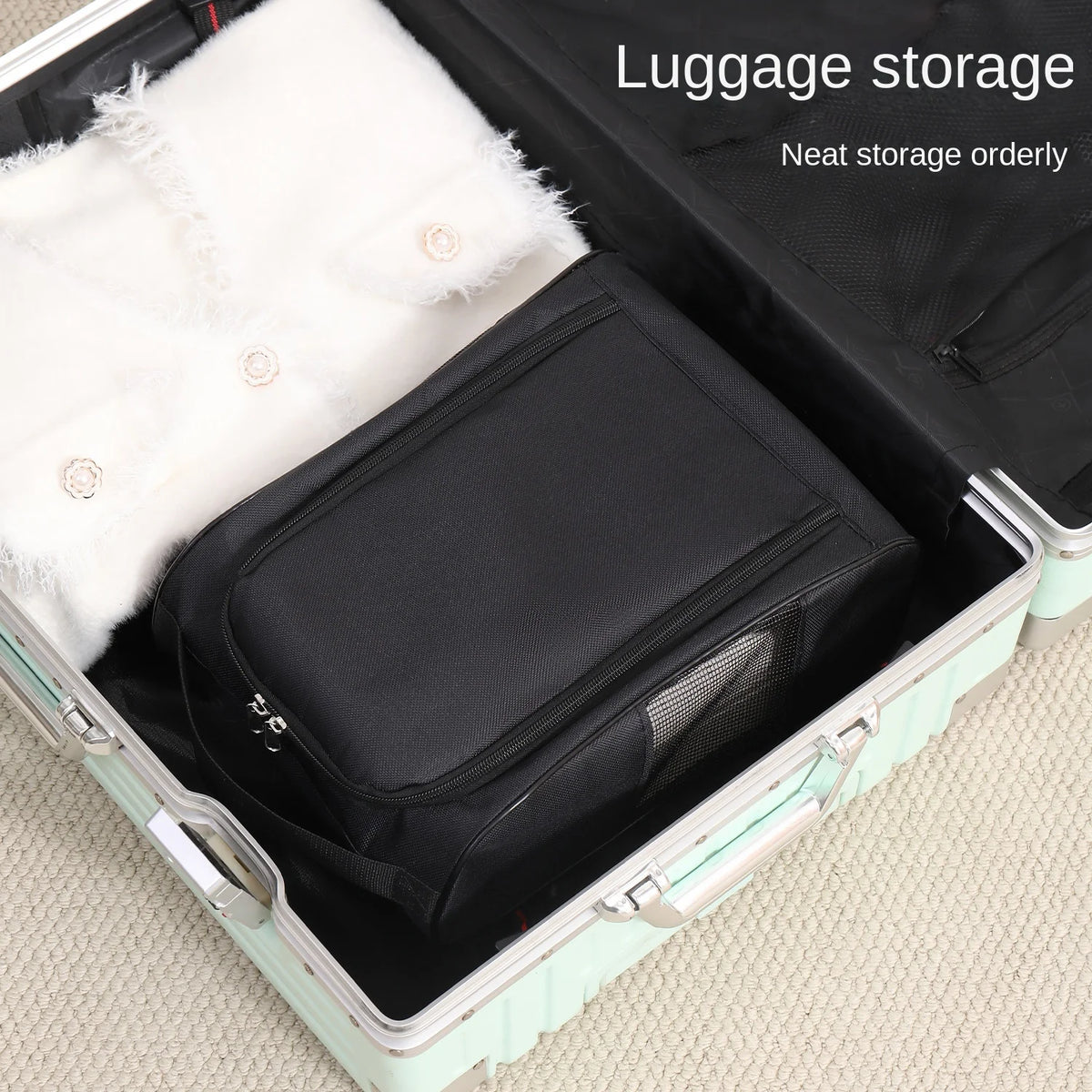 A black shoe carrier bag with a white fluffy lining is shown inside an open suitcase for luggage storage.