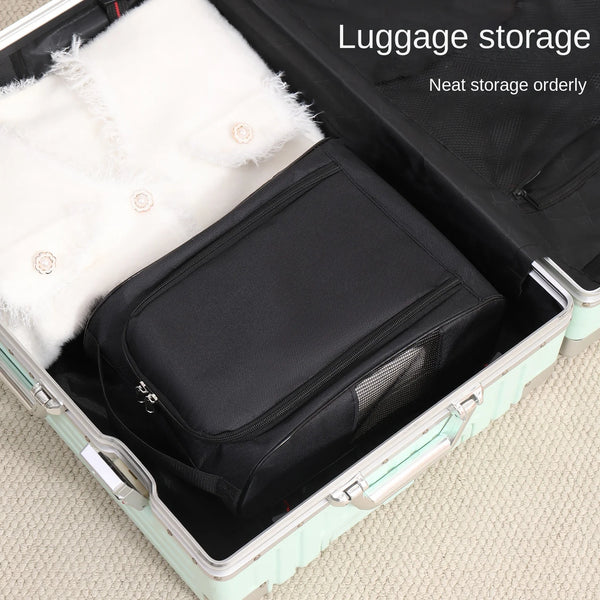 A black shoe carrier bag with a white fluffy lining is shown inside an open suitcase for luggage storage.