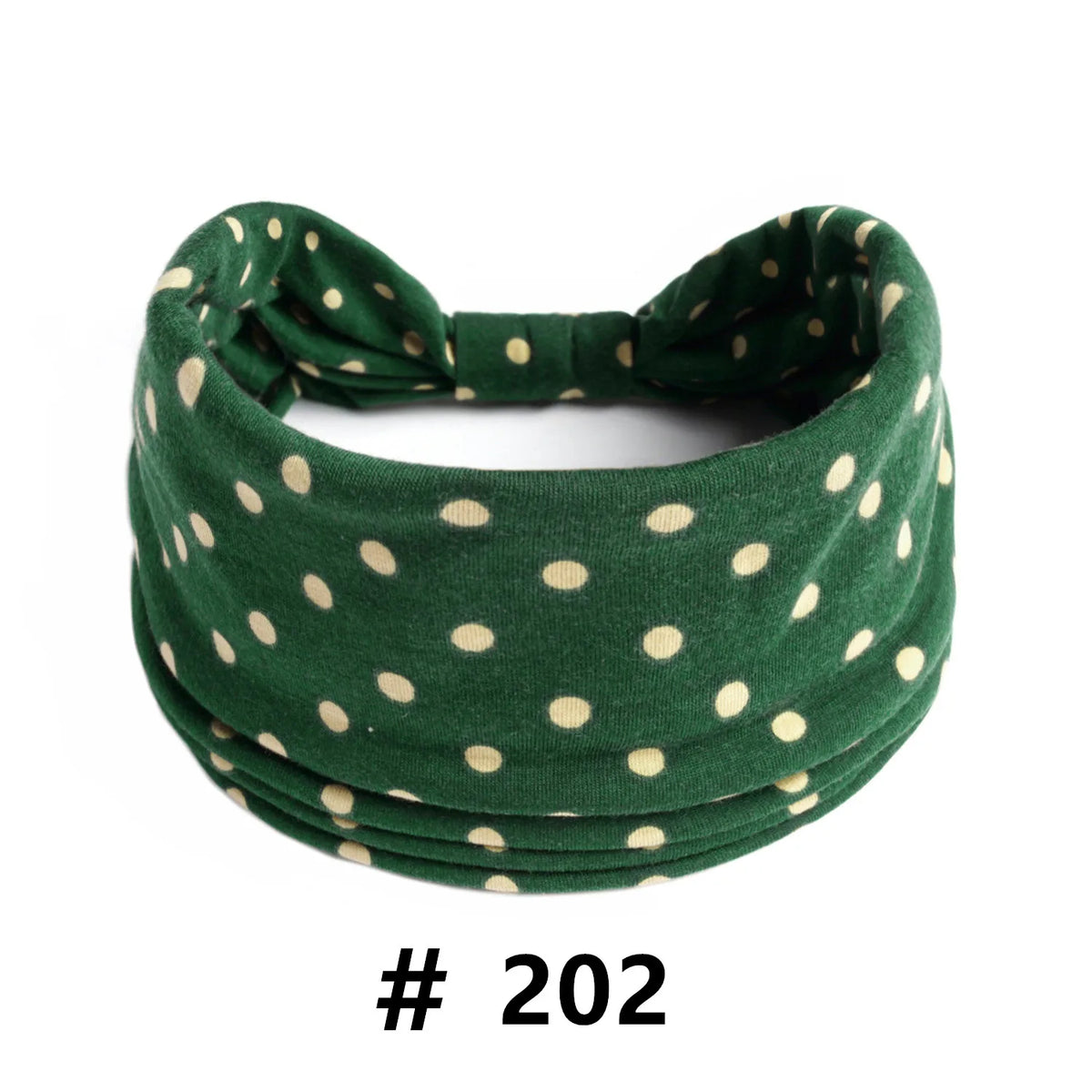 Dark green knitted headband with small beige polka dots