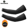 Black cycling arm sleeves designed to keep warm for athletic use