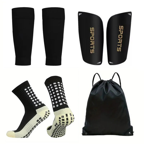 A pack of four black non-slip silicone sports socks for football and basketball