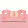 A pink adjustable posture corrector belt designed for back and shoulder support.