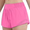 Pink women's high-waisted running shorts shown on a model.