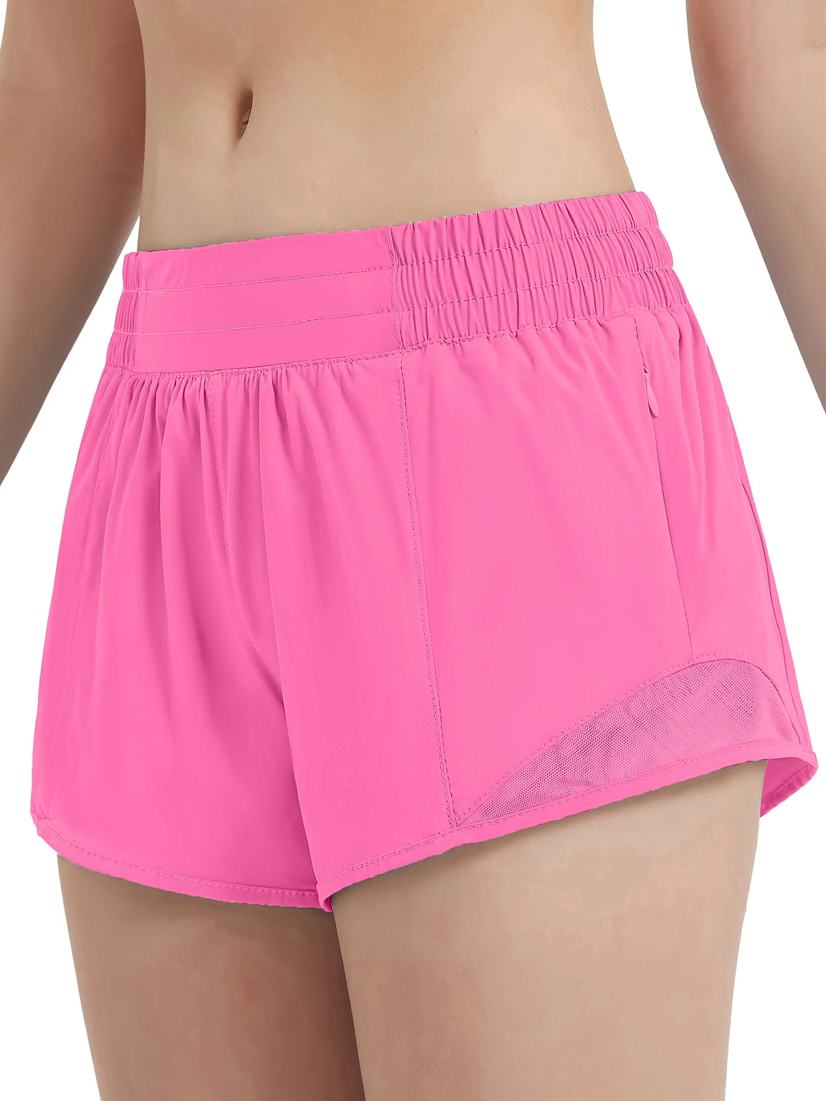 Pink women's high-waisted running shorts shown on a model.