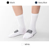 A pair of white high elastic cycling and hiking socks displayed on a flat surface.