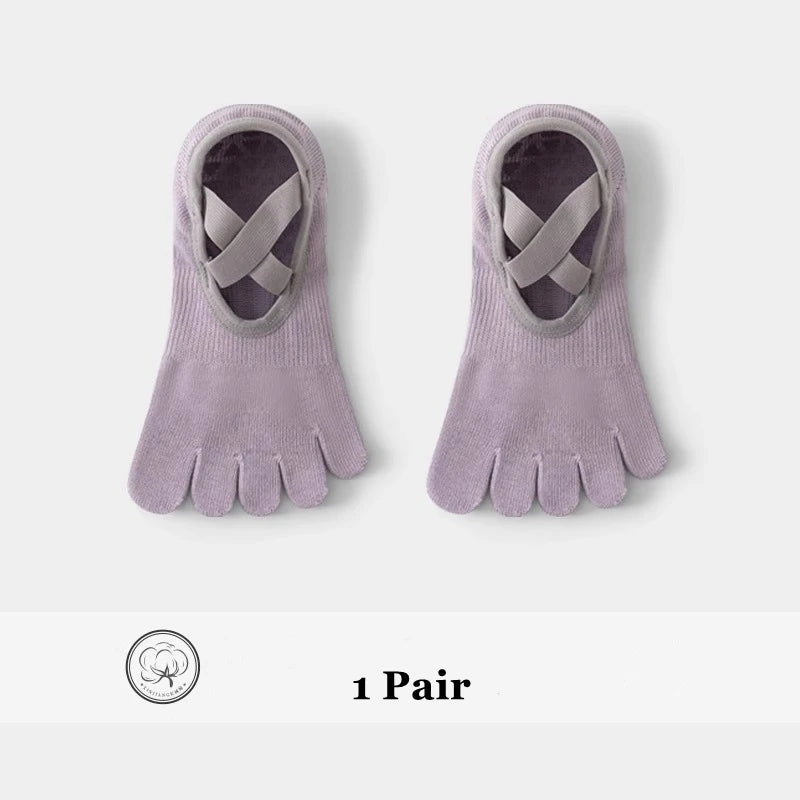 A pair of lilac five-finger invisible yoga and fitness socks with a woven design.