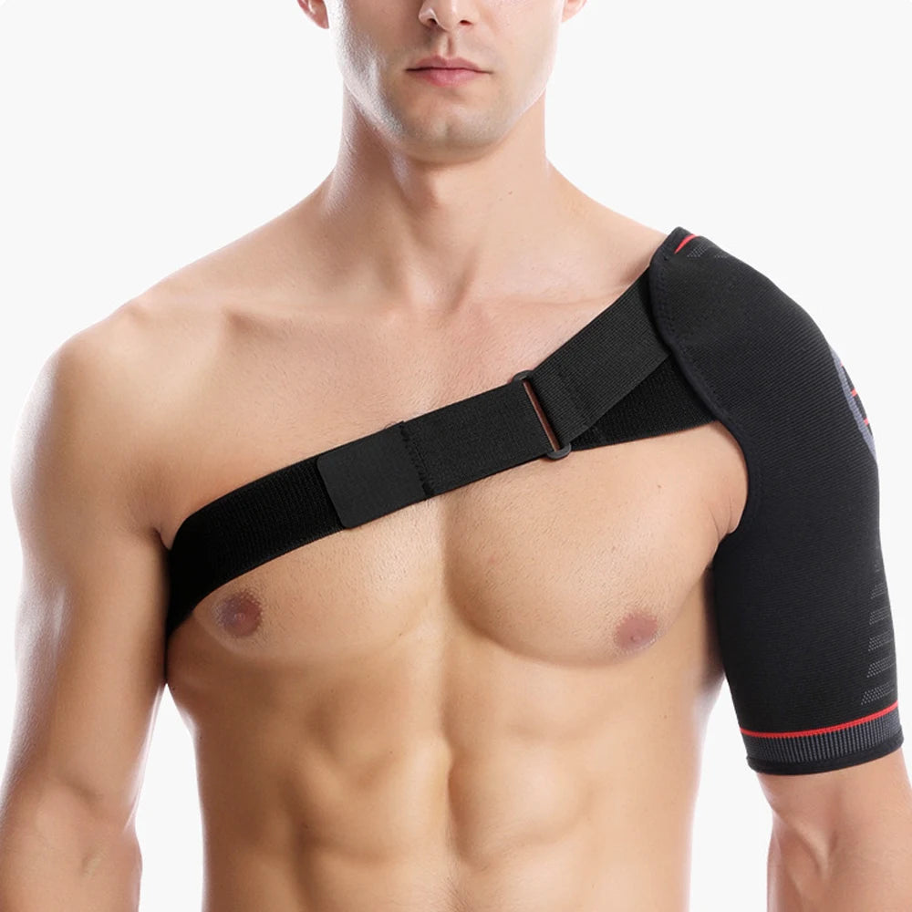 A male model wearing a black comfort compression shoulder support brace on his upper arm.