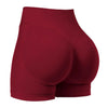 Un pantalon de yoga sans couture, taille haute, de couleur marron, vu de l'arrière.