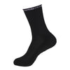 Black performance sports gripping socks shown in a side view.