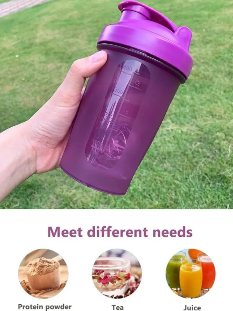 A hand holds a purple leak-proof shaker bottle filled with liquid, demonstrating its use for fitness and hydration.