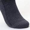 A close-up view of a dark grey bamboo fibre anti-odor sock.