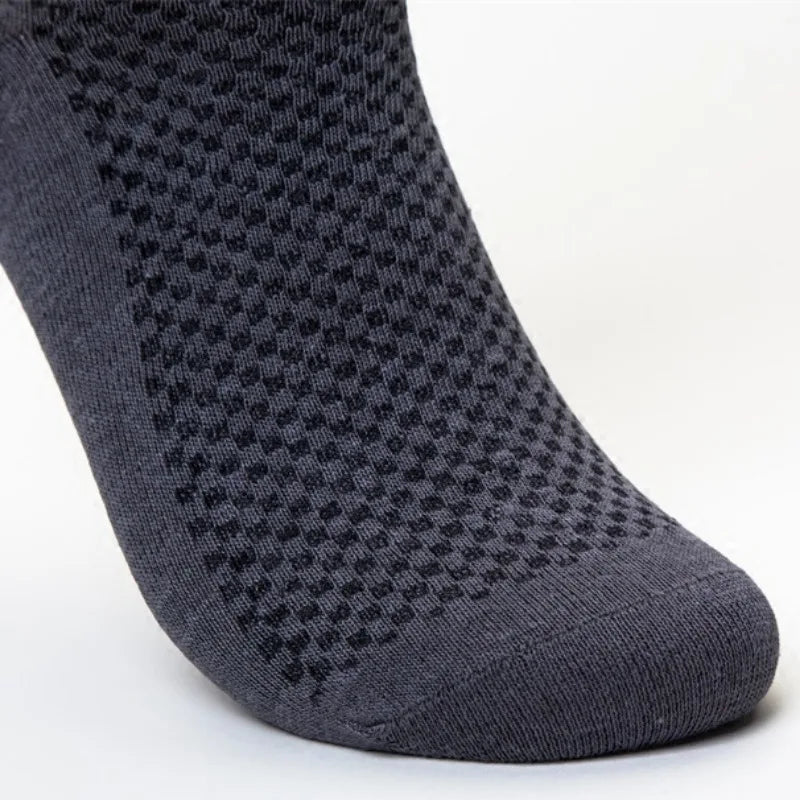 A close-up view of a dark grey bamboo fibre anti-odor sock.