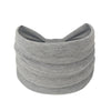 A gray boho wide headband hair wrap for women rolled into a cylindrical shape.