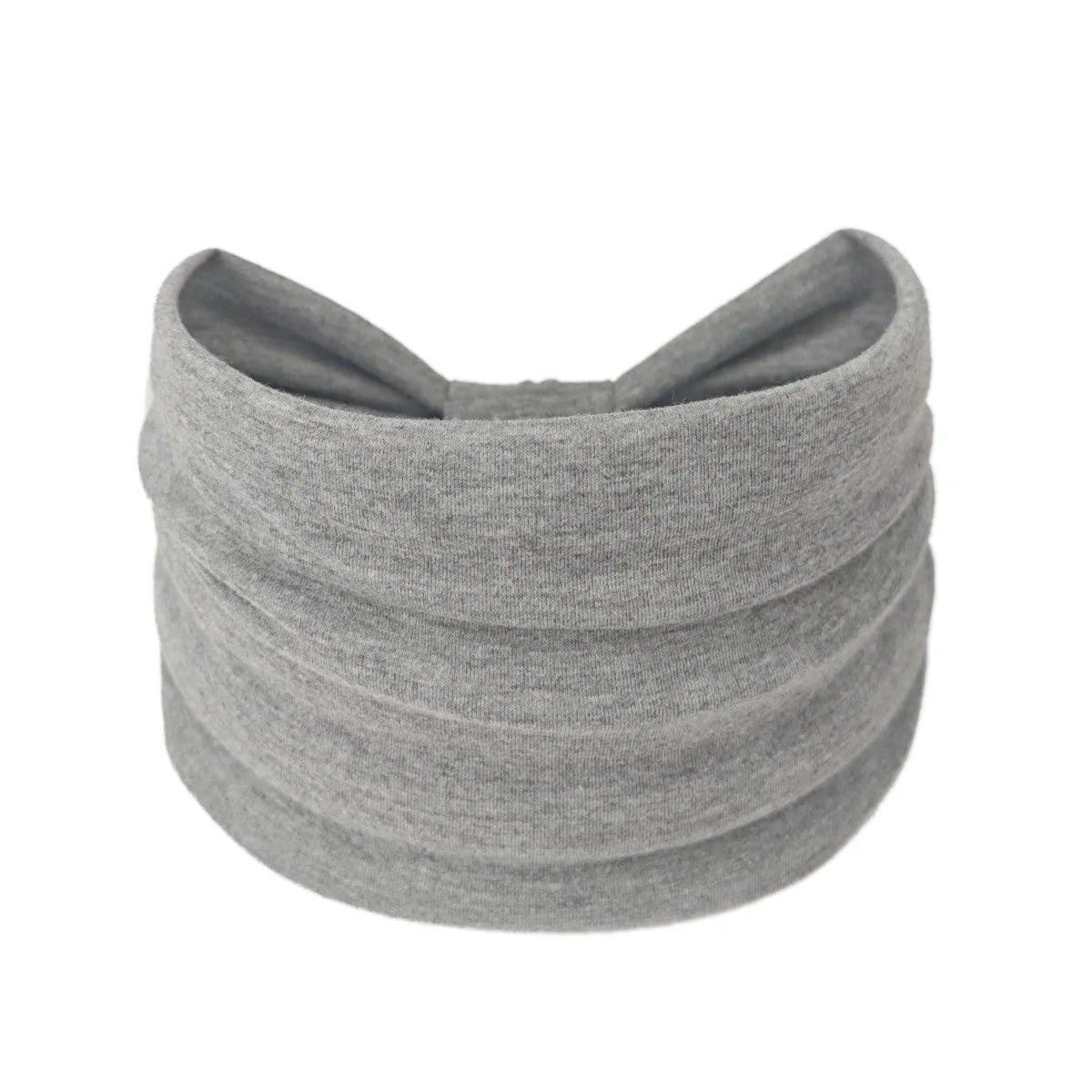 A gray boho wide headband hair wrap for women rolled into a cylindrical shape.