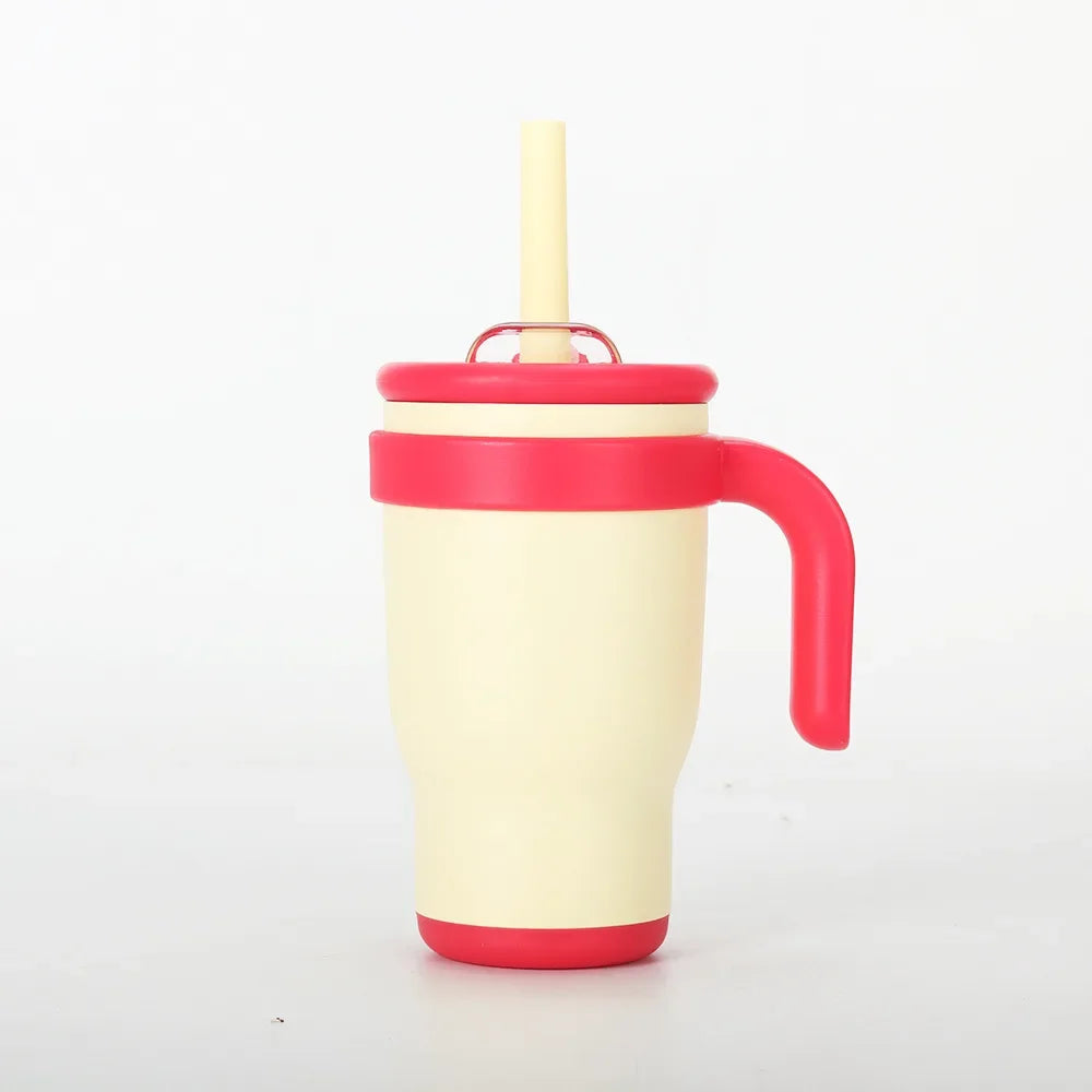 A white and pink stainless steel travel mug with a lid and handle.