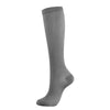 A full-length image of a gray compression sock for vein health.