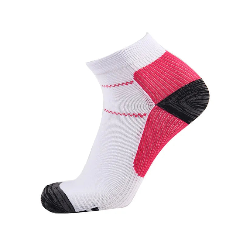 A pair of white compression socks with red and black stripes on the top section.