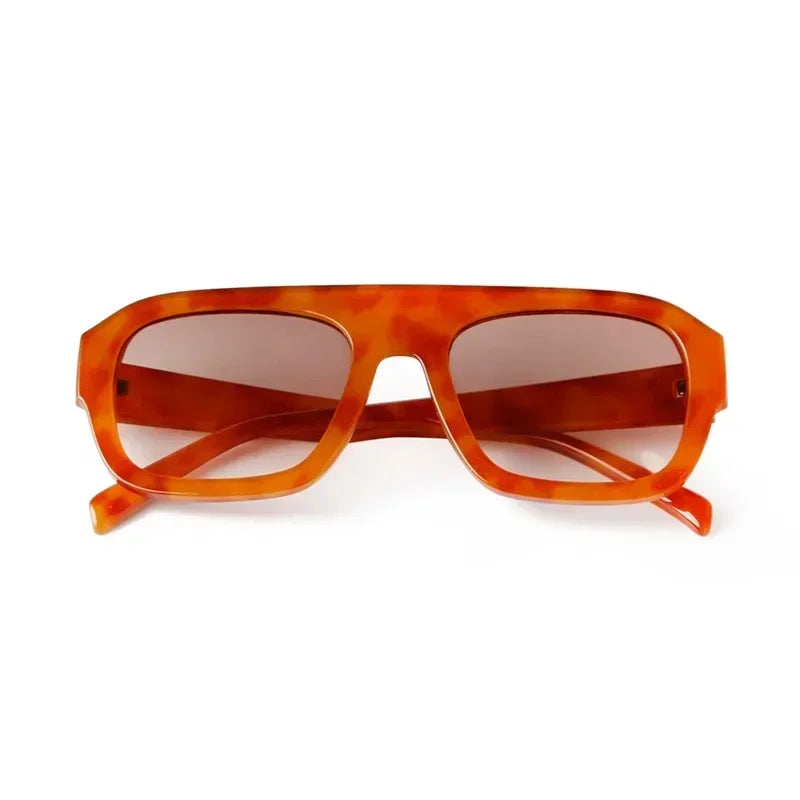 Vintage oversized square sunglasses with an orange tortoiseshell frame and lens.