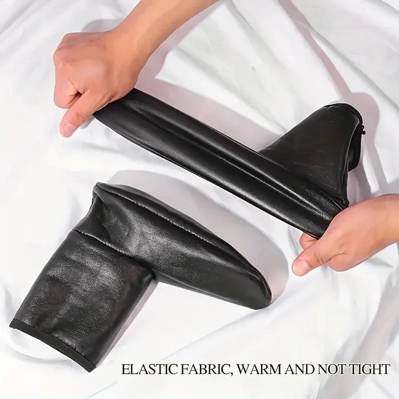 Black elastic fabric warm and not tight men's outdoor sports socks being held by a hand
