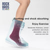 A close-up of a person wearing Rock Bros road to sky cycling socks with pink and light blue accents.