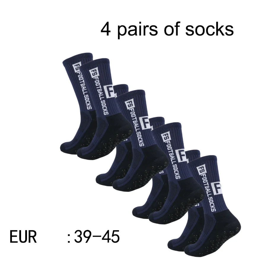 Four pairs of navy blue men's athletic soccer socks with non-slip grip