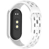 A white silicone smart watch band replacement with a black display and textured outer surface.