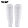 A pair of white compression leg sleeves for pain relief, shown vertically.
