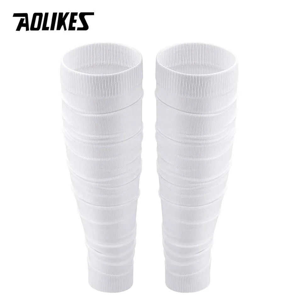 A pair of white compression leg sleeves for pain relief, shown vertically.