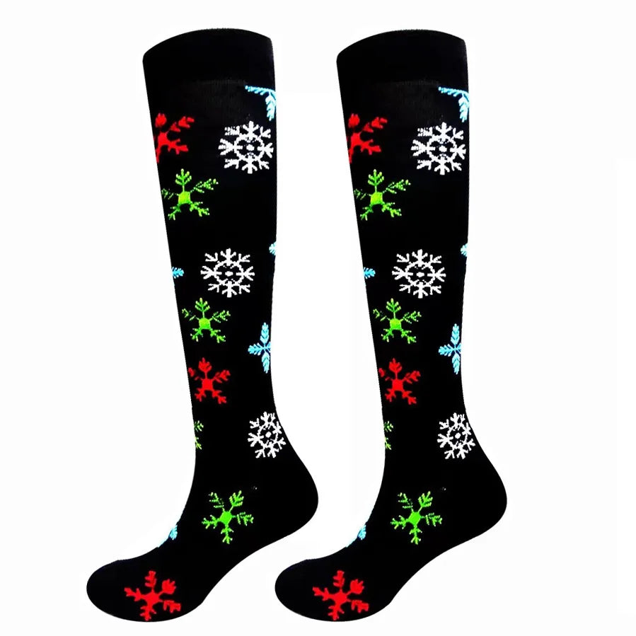 Black compression elastic socks decorated with red, white, and green snowflake patterns