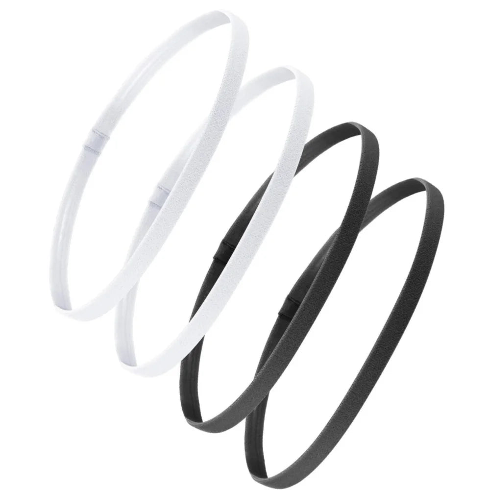 Ein Set von vier weißen und schwarzen elastischen Sport-Headbands in kreisförmiger Anordnung.