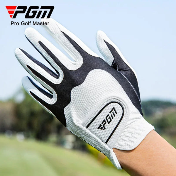 A close-up of a white and black PGA Pro Golf Master glove being worn on a hand in an outdoor golf setting.