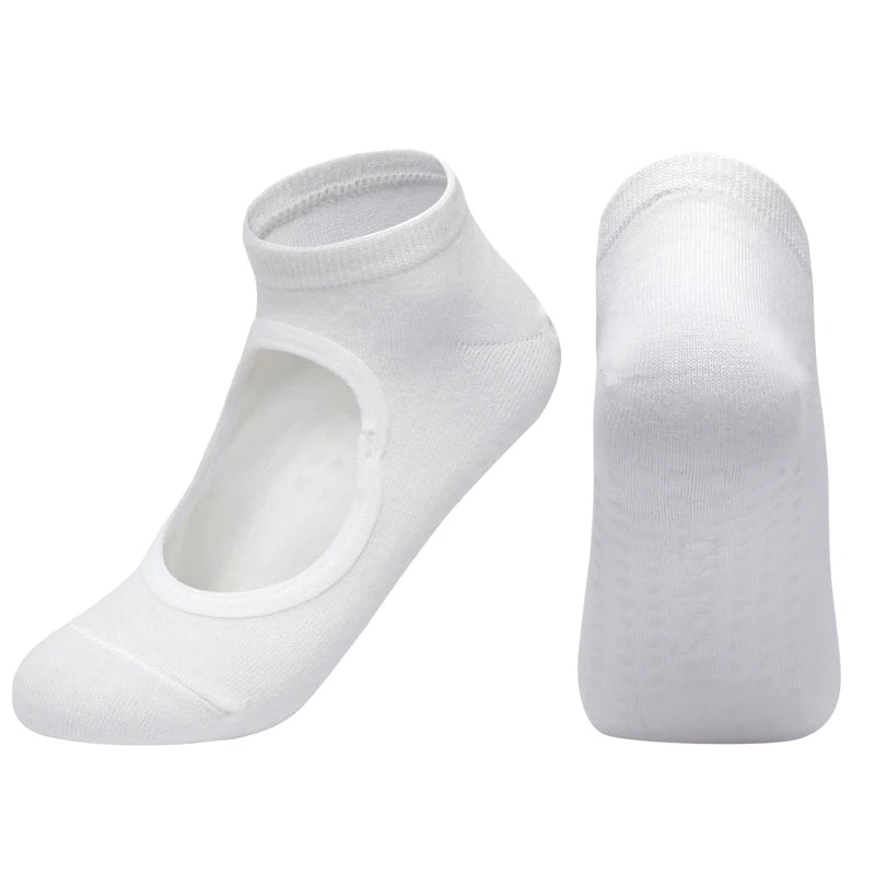 A pair of white breathable women's pilates and yoga socks, shown from a side view.