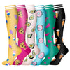 A row of colorful compression socks featuring various patterns like fruit and food items.