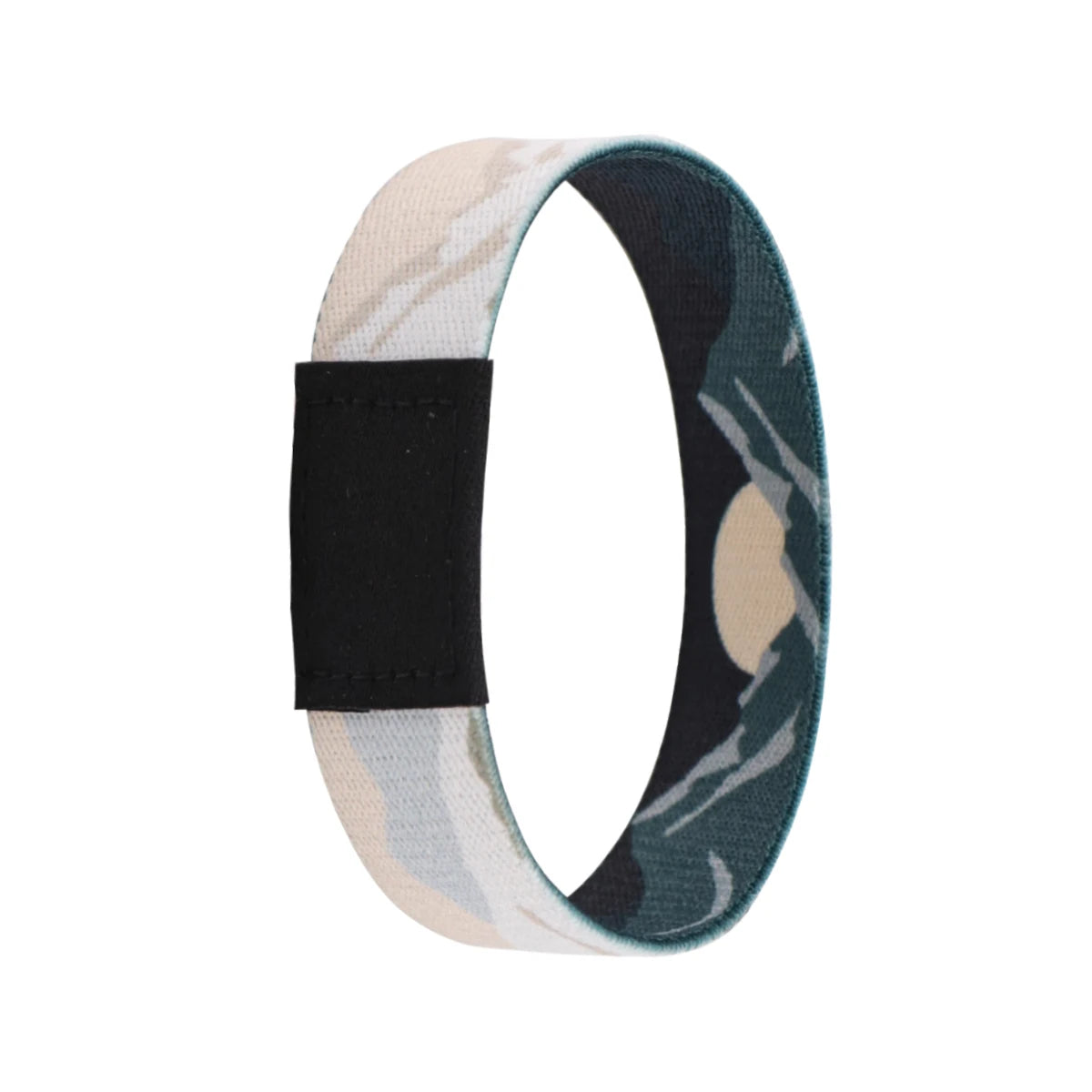 A wristband bracelet featuring a camouflage pattern with light beige and dark green colors.